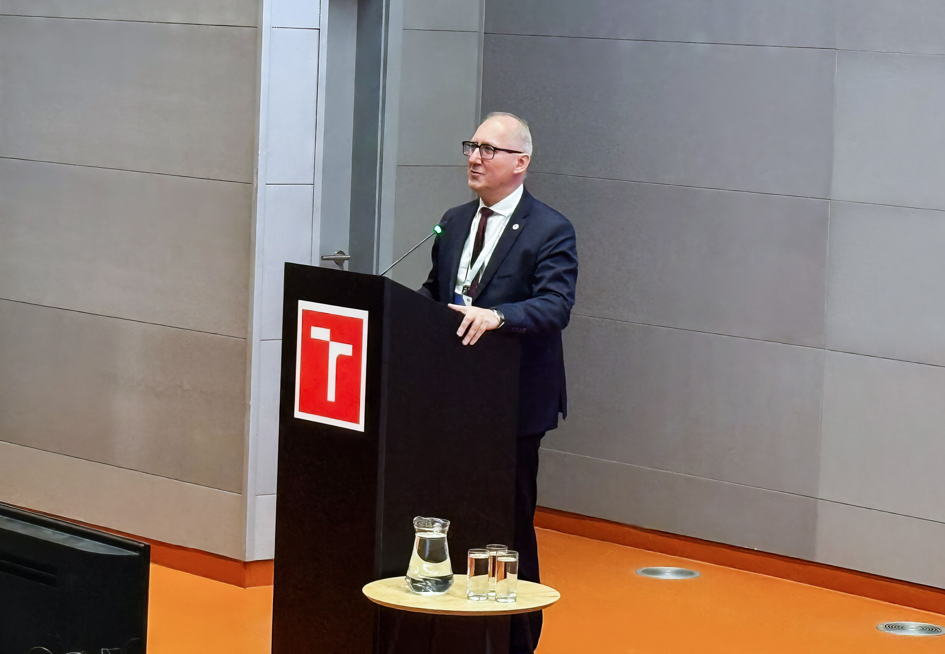 In a conference hall with the Brno University of Technology logo, the Rector of Wrocław Tech delivered a speech: